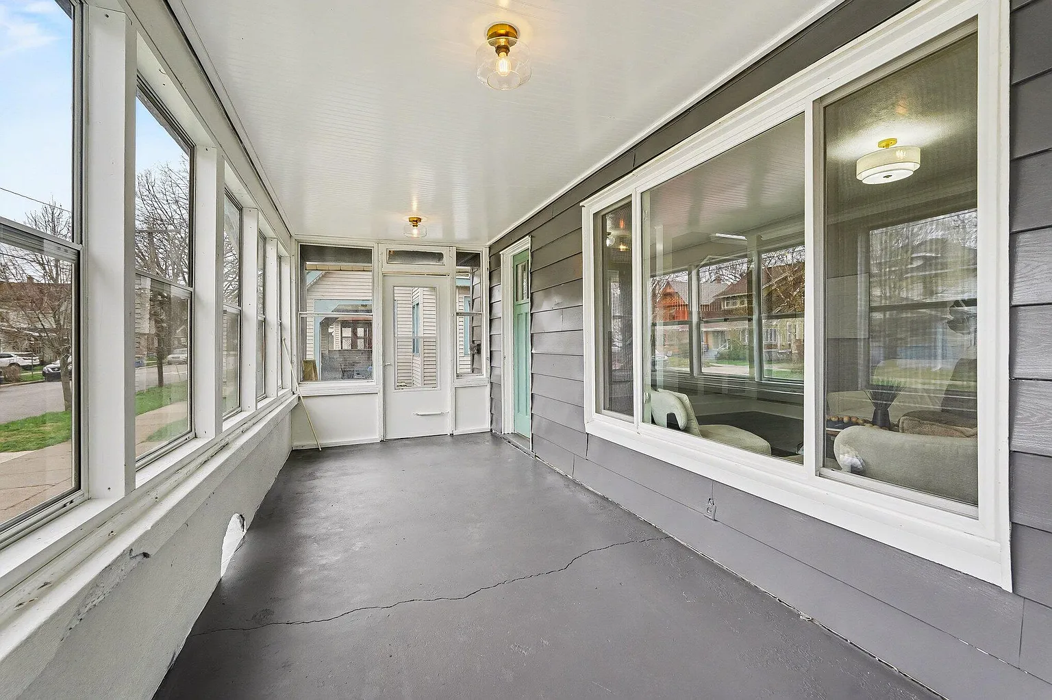 Screened porch with new windows and painted floor